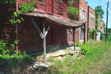 abandoned, overgrown storefronts