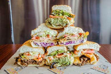 Ike’s Love &amp; Sandwiches stack of subs