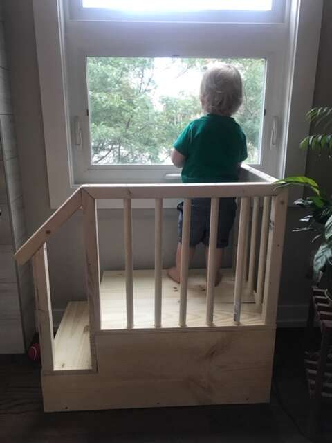 Dad builds a fort so his son can look out the window