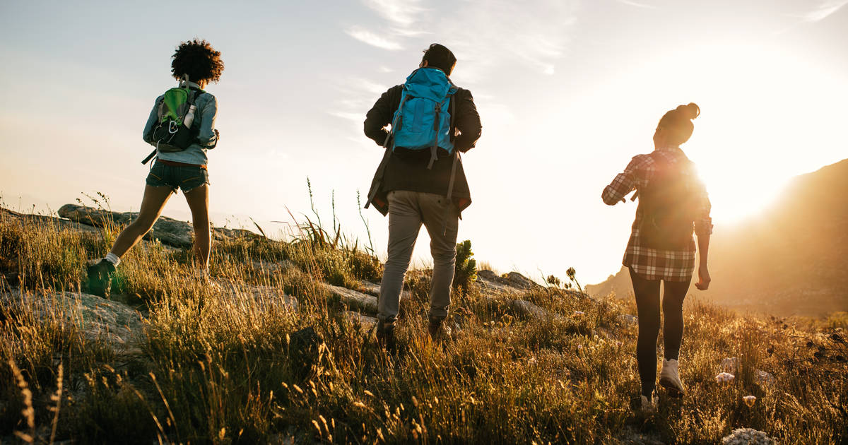 Woman with friends hiking in country side stock photo (154688