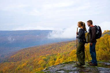 two hikers posted at the top of a mountain