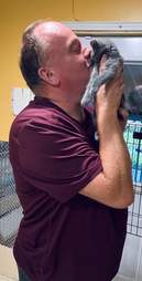 volunteer adopts kitten