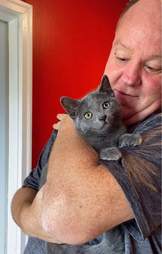 volunteer adopts kitten