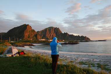 camper taking photos of coastal landscape