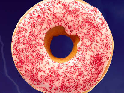 Dunkin's new spicy ghost pepper donut has pink icing and shiny red sprinkles