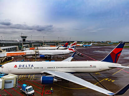 A Delta airplane on the ground. 