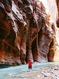 man in river canyon