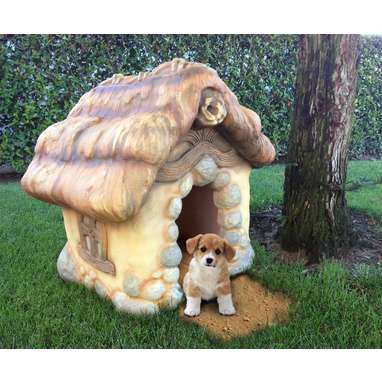 A storybook-style dog house that looks like it was carved from your dreams