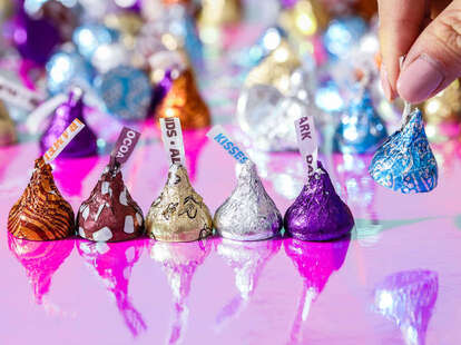 Several varieties of Hershey's Kisses in various colors of foil wrappers. 