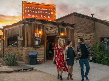 a group of friends in front of Pappy and Harriet's