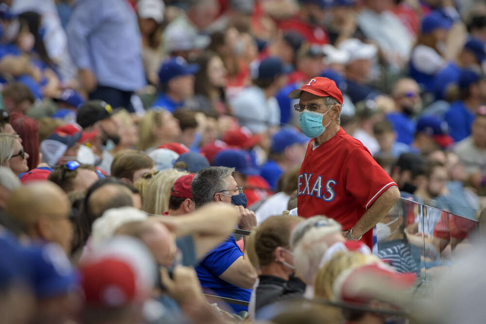 Texas Rangers play MLB home opener in front of packed stadium.