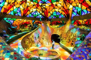 a woman in a kaleidoscopic room