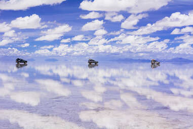 cars driving across the Uyuni Salt Flat