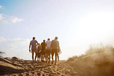 people walking on a beach