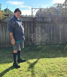 Guy and giant spider web