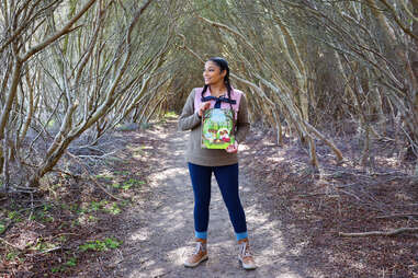 Ambreen Tariq, founder of Brown People Camping, standing in the woods