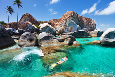 woman snorkeling at The Baths beach on Virgin Gorda