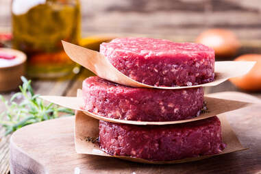 raw burgers preparing for grill