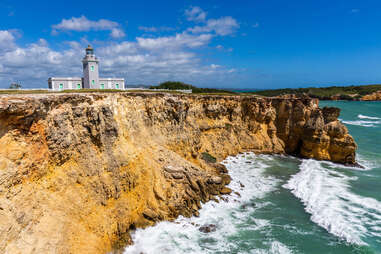 Los Morillos Lighthouse at Cabo Rojo, Puerto Rico, a gray lighthouse on a cliff