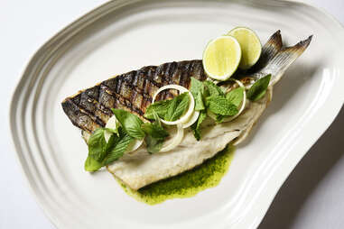 Whole roasted branzino with salsa verde, mint, and basil