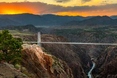 a long skywalk bridge over a valley