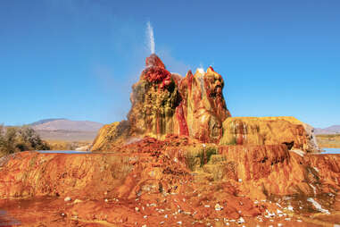 a giant, colorful, active geyser in the desert