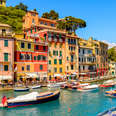 boats floating in the picturesque harbor of Portofino, an Italian fishing village