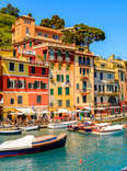 boats floating in the picturesque harbor of Portofino, an Italian fishing village