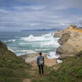 person standing in front of a stormy bay in Oregon