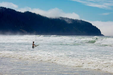  Surfer on the beach of Cape Lookout State Park