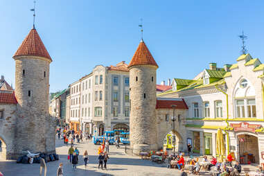 people walking through a medieval European old town