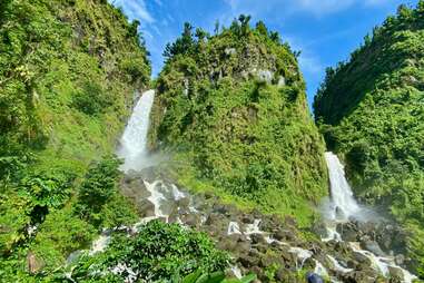 two waterfalls in a lush jungle