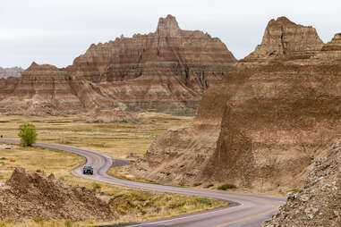 car driving through badlands