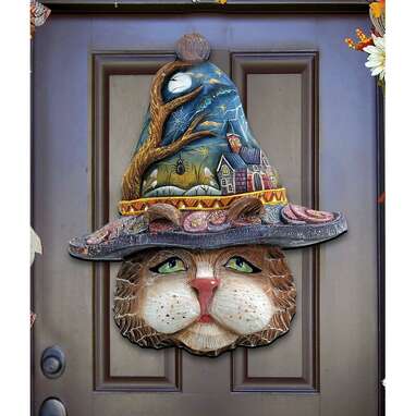 This witchy cat door hanger: Halloween Eve Cat Hanging Figurine Wood Door Hanger Wall Decor