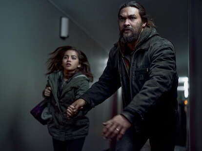 Isabela Merced and Jason Momoa running in Sweet Girl