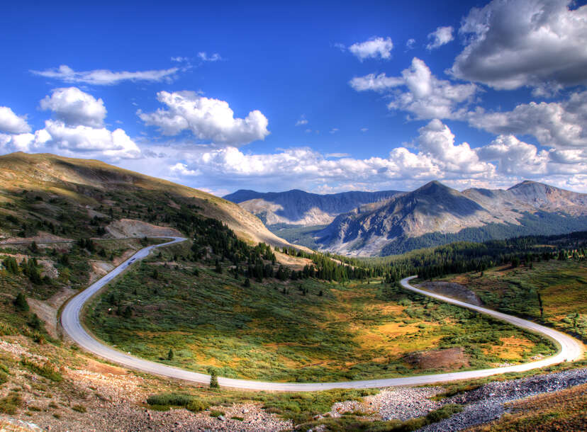 Steep steps on mountain path to the green alpine valley