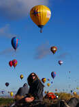 balloons in the sky with spectators