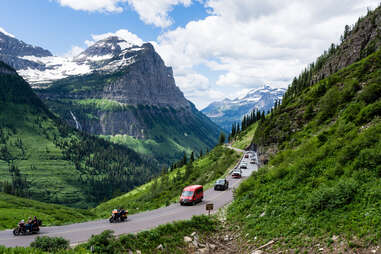 cars driving along a mountain highway pass