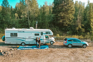 a family posing in front of their rv