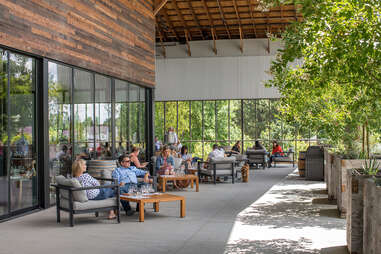 people lounging in an alfresco eating space