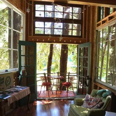 A magical treehouse in the thick of an old-growth redwood grove
