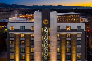 a ritzy hotel with mountains in the distance