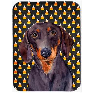 A glass cutting board for prepping your fave Halloween foods: Caroline's Treasures Halloween Candy Corn Dachshund Portrait Glass Cutting Board