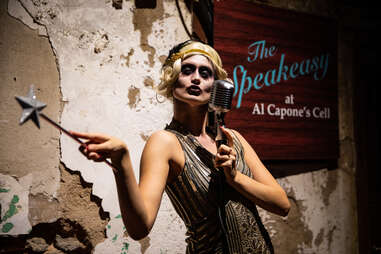 An actress dressed as a ghostly flapper