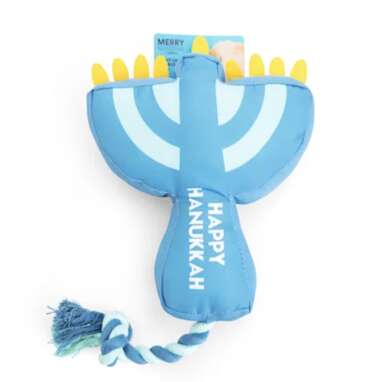 He’ll be all lit up with this one: Hanukkah Light Up the Night Menorah Plush & Rope Dog Toy