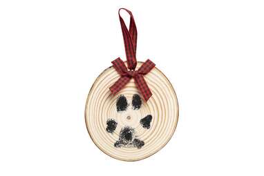 This ornament that’s one of a kind: Pearhead Wooden Pawprints Ornament