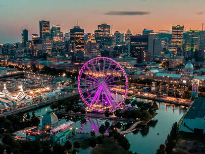 a huge ferris wheel in the middle of a major city