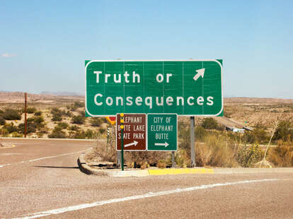 a town sign in the desert reading Truth or Consequences