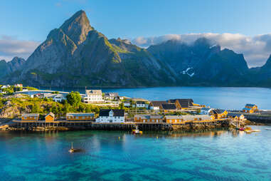 a fishing village in the shadow of an enormous mountain