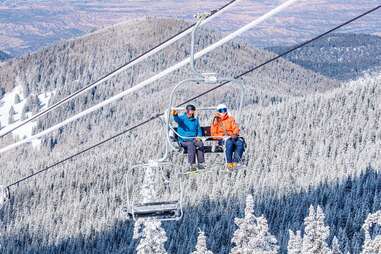 a person skiing down a snow covered mountain